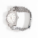 vintage rolex datejust ss, on its side with crown present