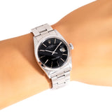 vintage rolex date auto black dial, wrist shot close up