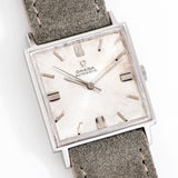 vintage omega square-shaped watch on its back